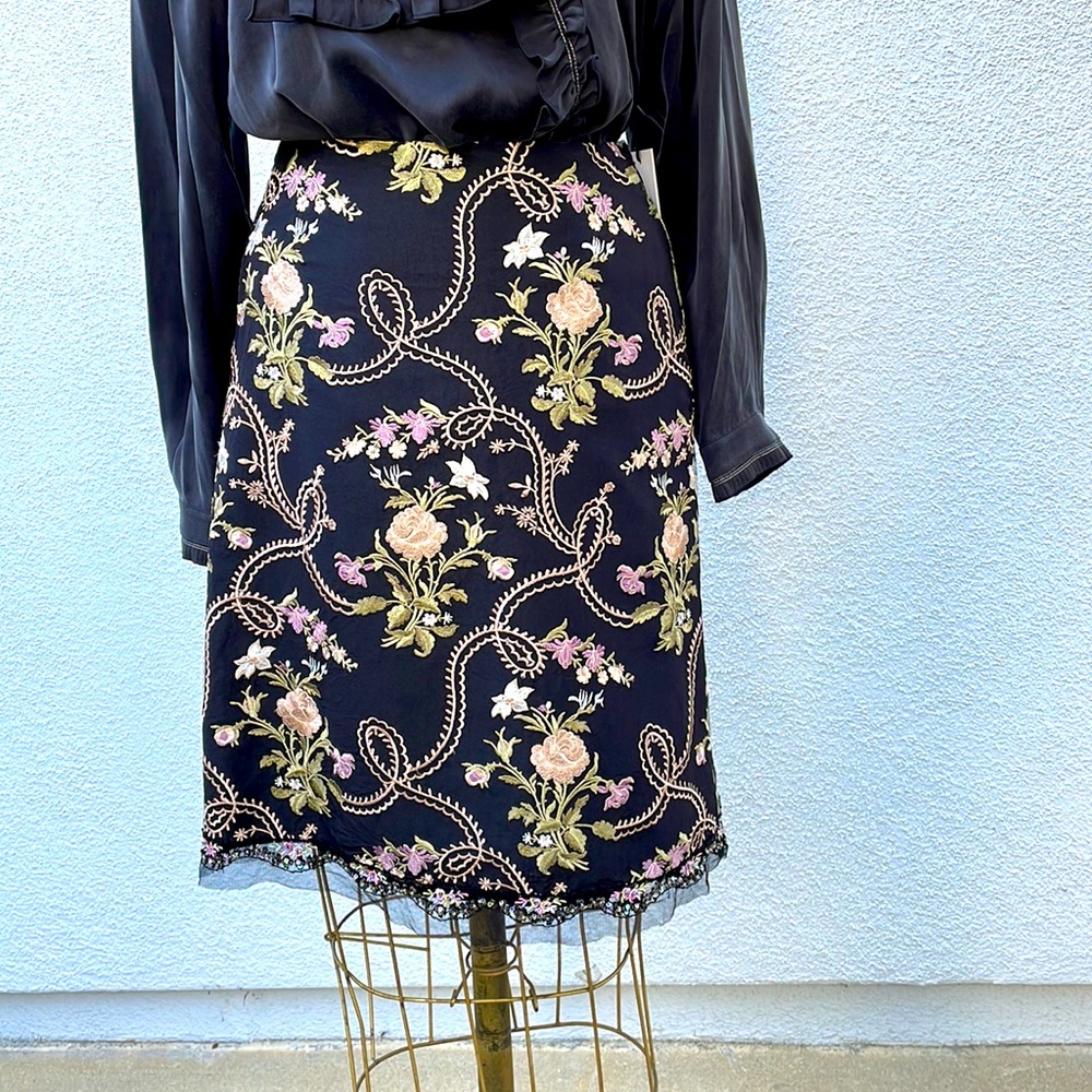 Beautiful lined embroidery skirt by Express with lace and sequined trim at hem
